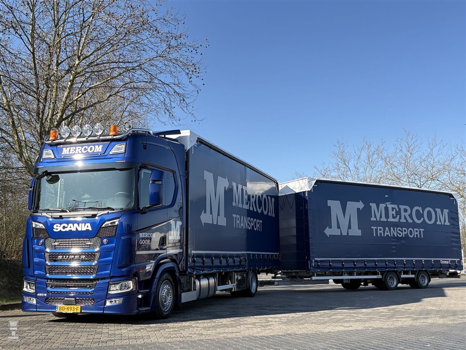 Mercom gaat lager met Scania